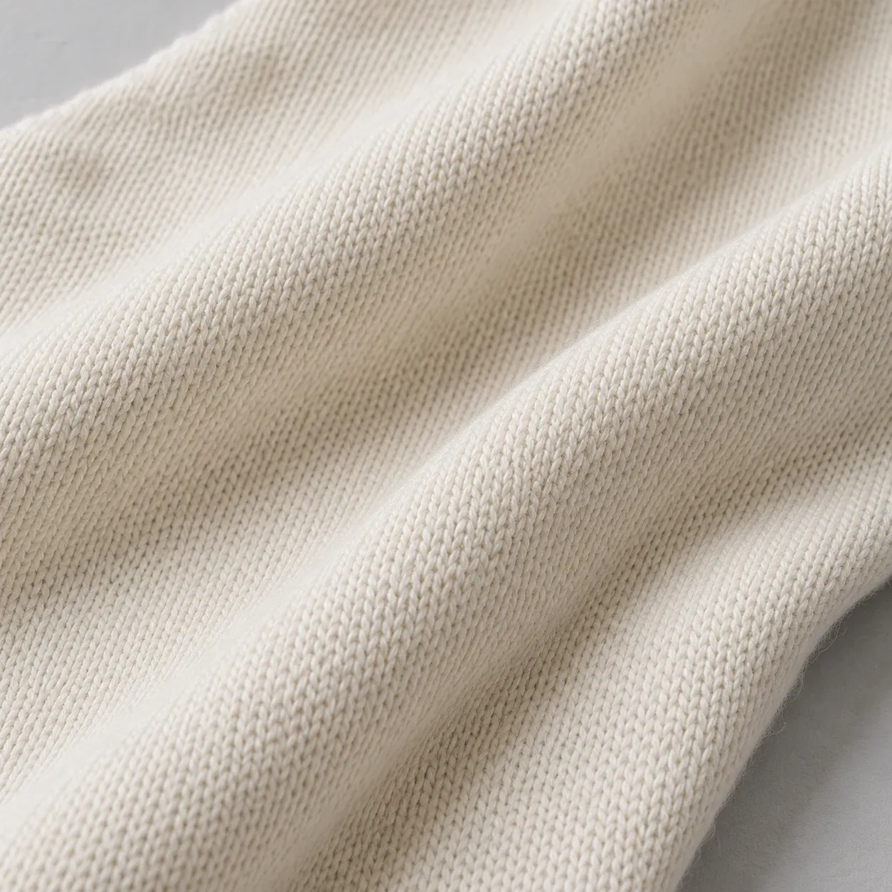 Close view of off-white cotton jersey in soft folds