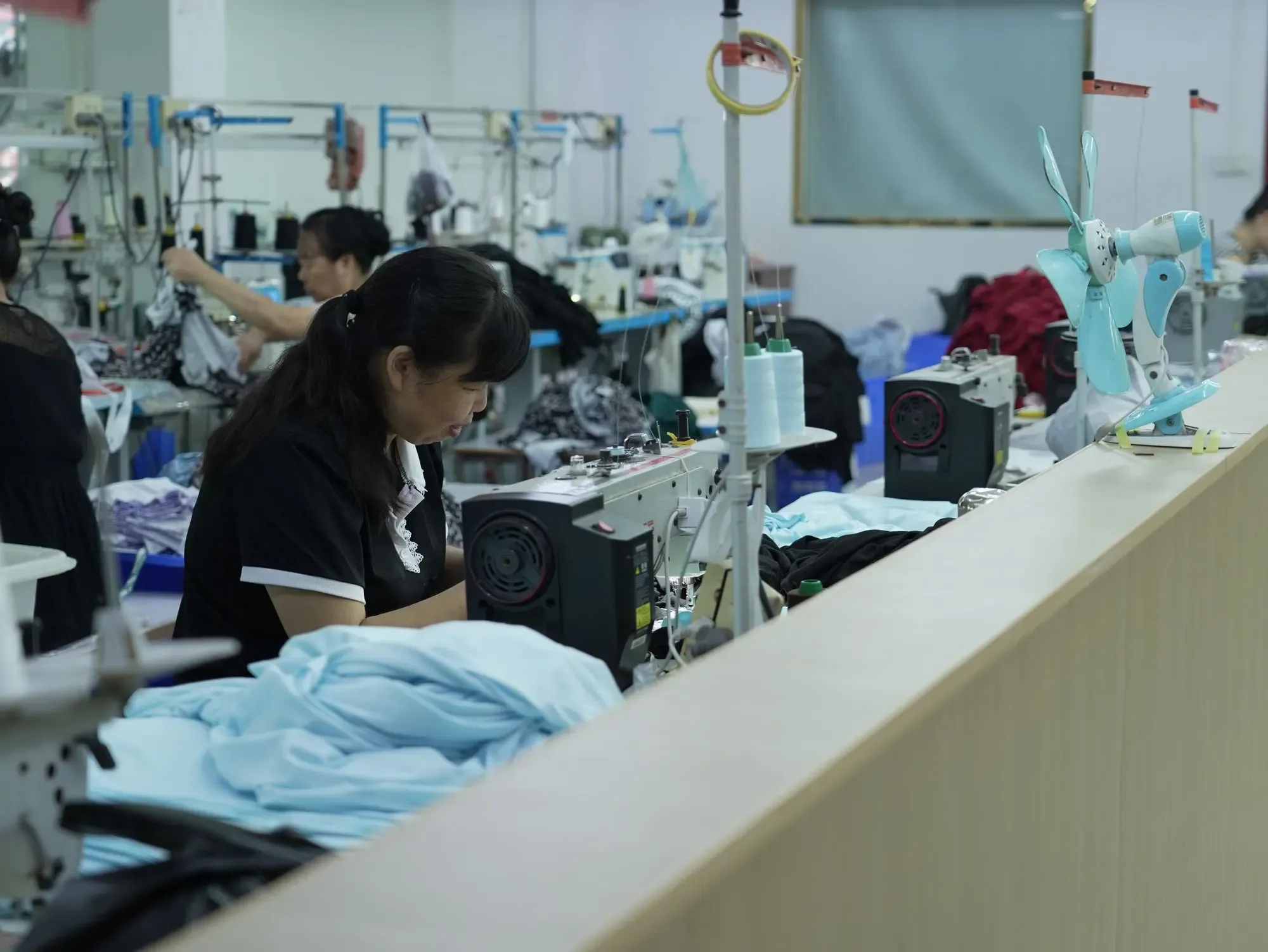 A sewing operator working at her machine