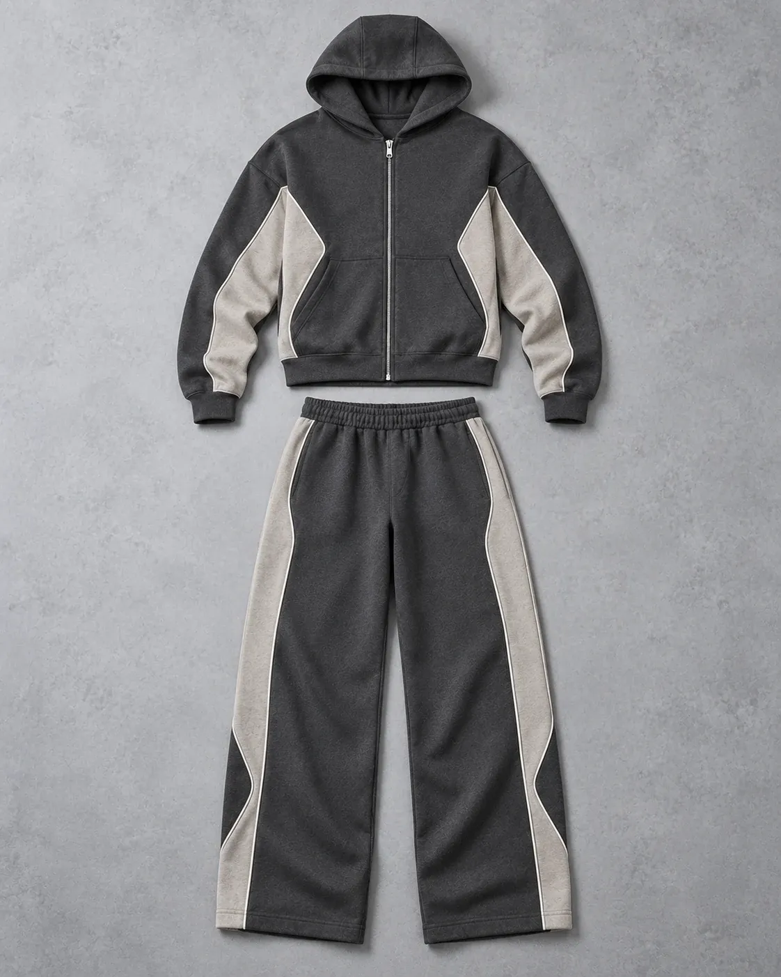 Charcoal and stone tracksuit jacket and wide-leg trousers laid flat